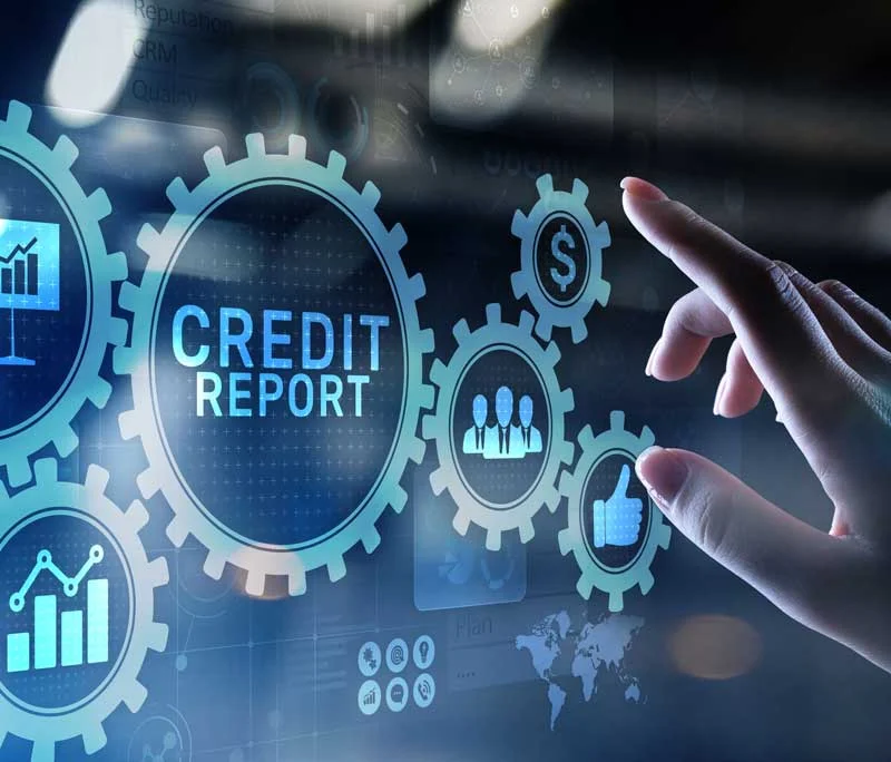 Hand reaching towards gears displaying "CREDIT REPORT" alongside financial icons, symbolizing credit report corrections and consumer rights in credit management.
